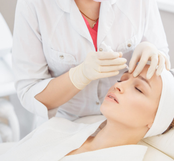 A Young female getting Botox Injection on forehead | Center for Aesthetic Medicine in Las Vegas, NV